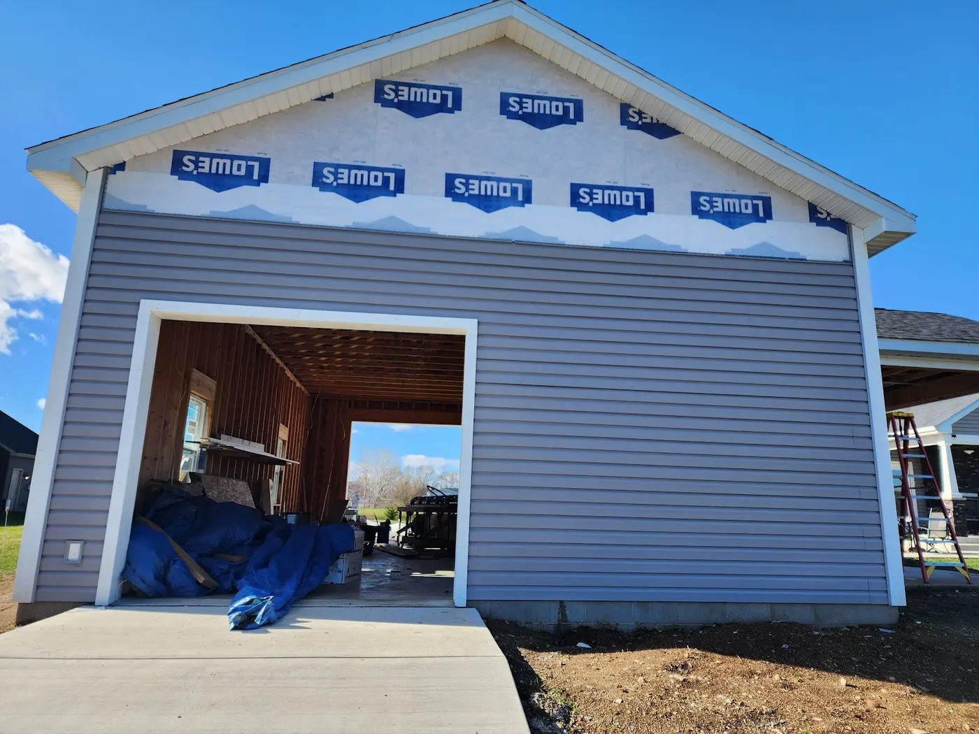 New garage — siding and gable trim — Helpful Home Solutions