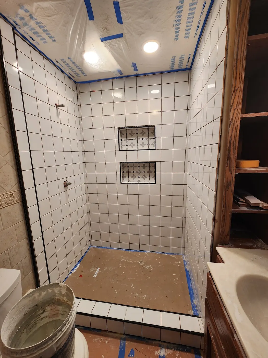 Custom tile shower with niches — Helpful Home Solutions