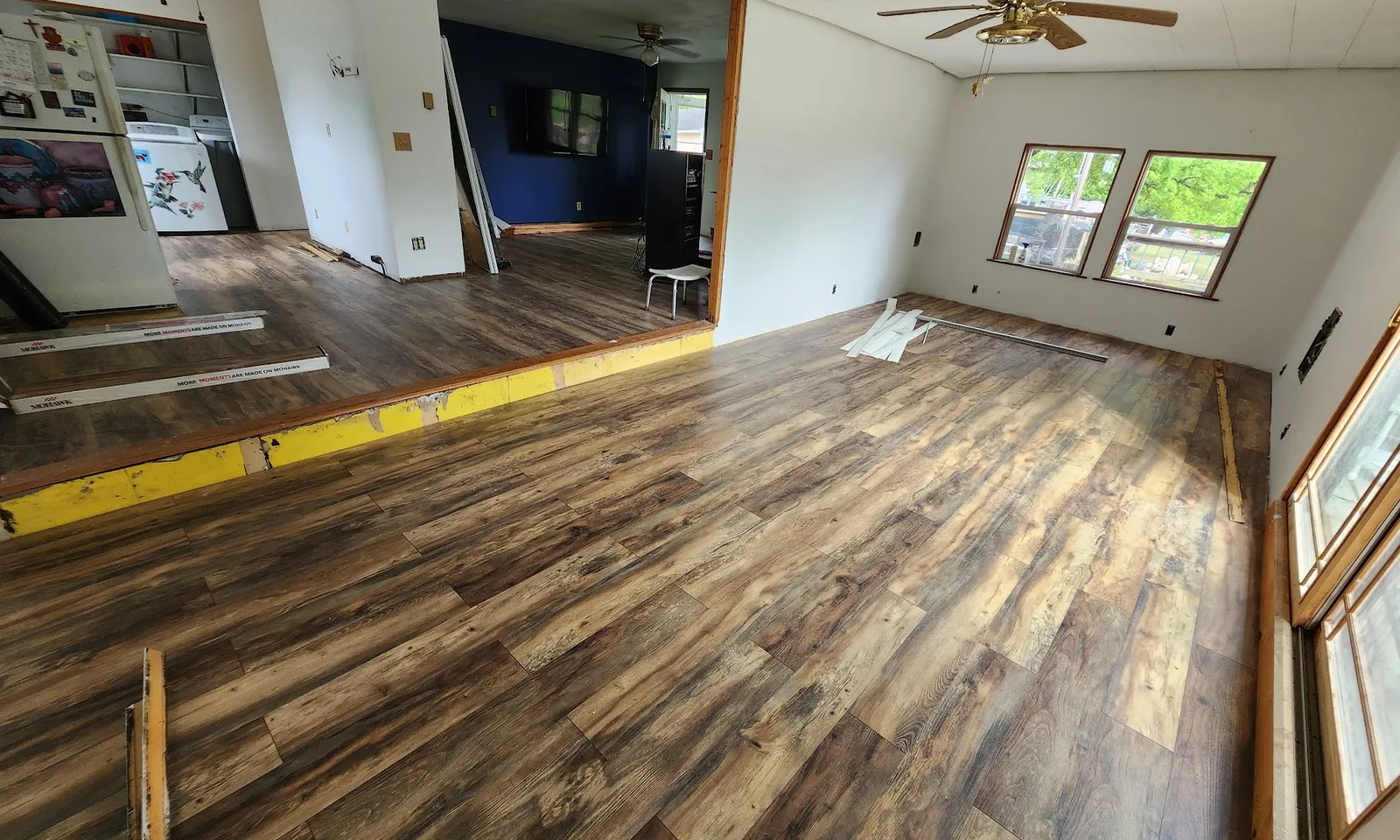 Careful flooring installation — measuring and marking planks